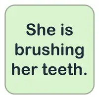 Picture for She is brushing her teeth. (O dişlerini fırçalıyor.)